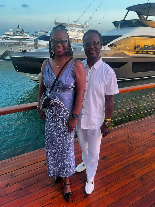Two travelers posing together on a cruise ship deck