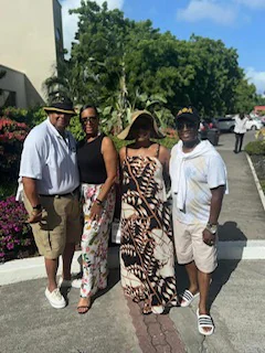 Friends walking together through a sunny tropical garden