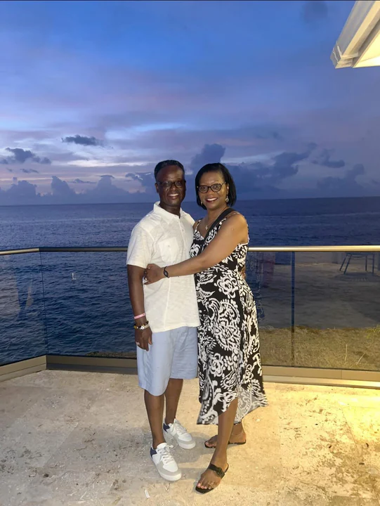 John and Veronica posing together outdoors at dusk