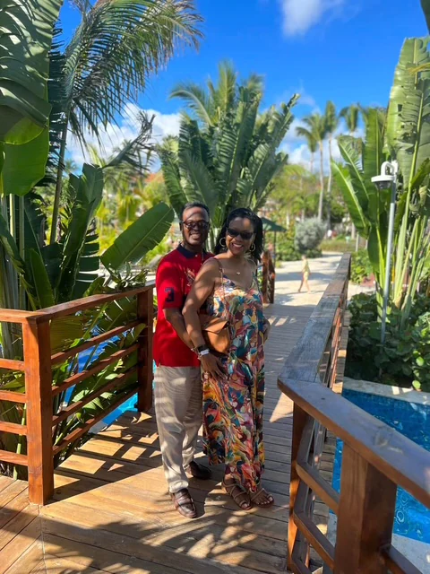 John and Veronica standing on a tropical wooden walkway